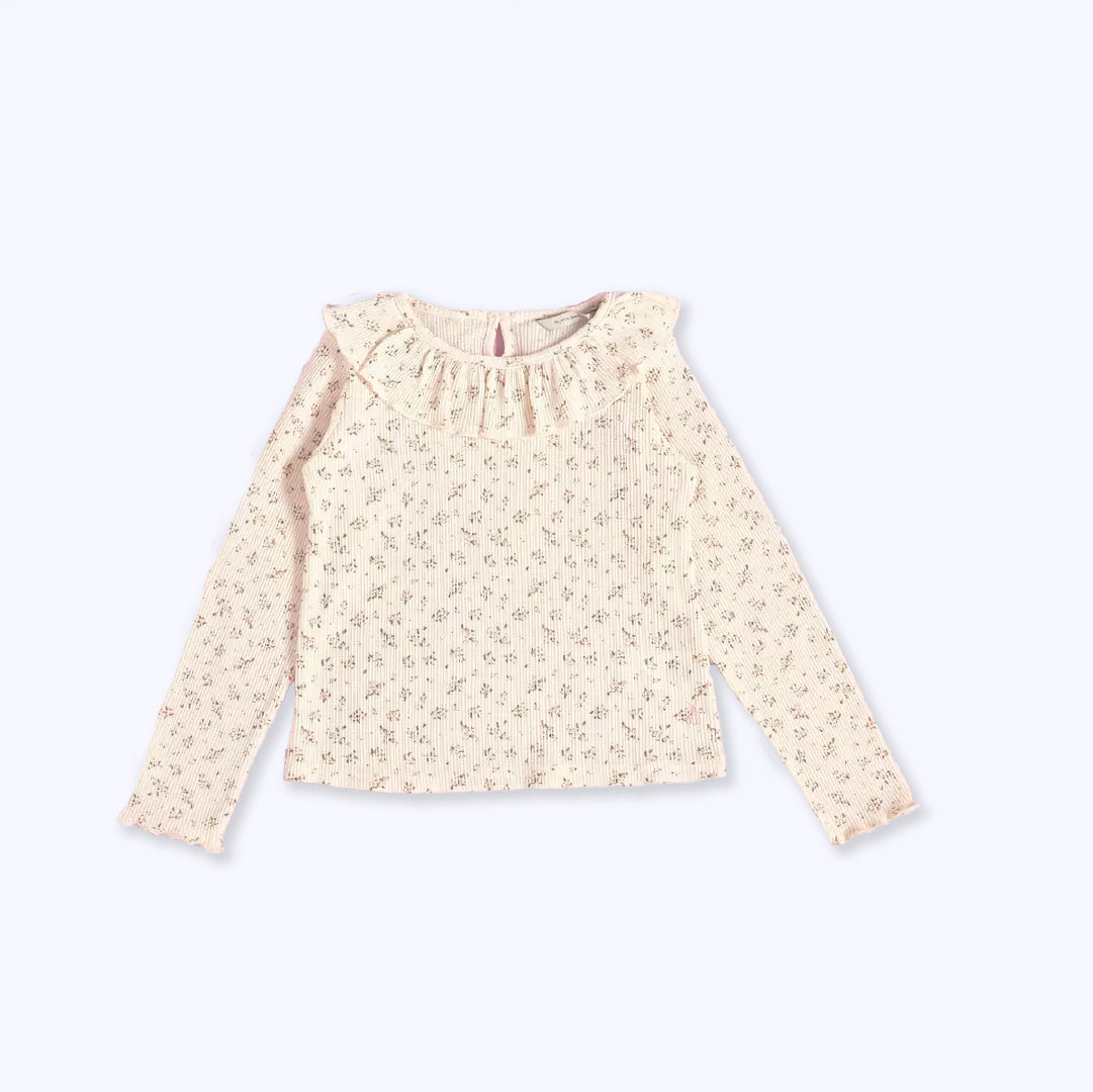 Polera cuello vuelo flor